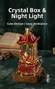 Macro view of vintage Christmas lantern decoration with Santa Claus and glitter snow