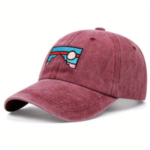 Classic burgundy washed cotton baseball cap with embroidered mountain patch seen from 45-degree angle