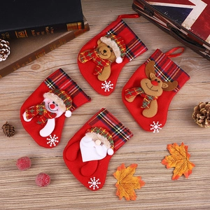Close-up of four festive Christmas stockings with 3D Santa, Snowman, Bear, and Reindeer motifs