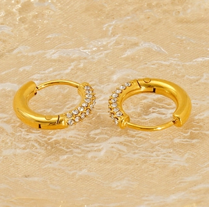 Macro detail of 18K gold-plated huggie earrings with double-row micro-set rhinestones