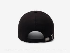 Detail view of the black baseball cap back with an adjustable fabric strap and metal buckle