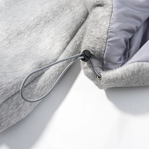 Close-up of grey faux fur jacket hood with adjustable drawstring and toggle detail