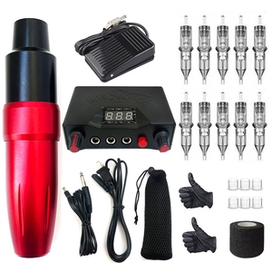 Macro shot of a complete red tattoo pen kit with power supply and sterile needles