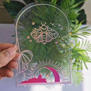 Rainbow suncatcher window cling with holographic moth and moon prism patterns