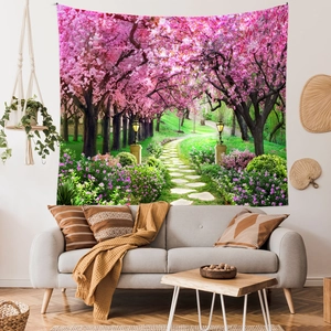 Detailed view of a cherry blossom forest tapestry hung over a minimalist living room sofa