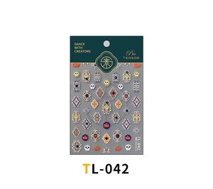 Macro detail of TL-042 nail stickers featuring Halloween pumpkin and skull relief patterns