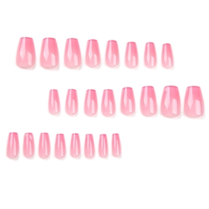Pink gradient coffin-shaped press-on nails with a high gloss jelly finish for a manicure