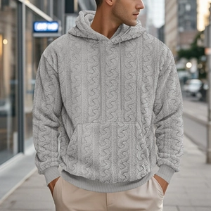Detailed texture of grey cable knit teddy fleece hoodie with kangaroo pocket and drawstring