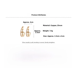 Détail des boucles d'oreilles double C plaqué or 18k avec croix en zircon et dimensions