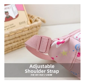 Detail of adjustable pink shoulder strap and cute cartoon print on children chest bag