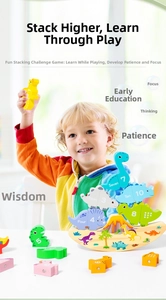 Close-up of child balancing colorful wooden dinosaur blocks with numbers and English words
