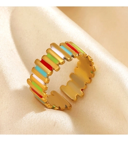 Macro view of colorful enamel geometric open ring on elegant cream silk background