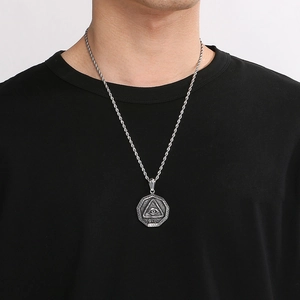 Silver stainless steel pyramid Eye of Horus pendant on man with rope chain necklace