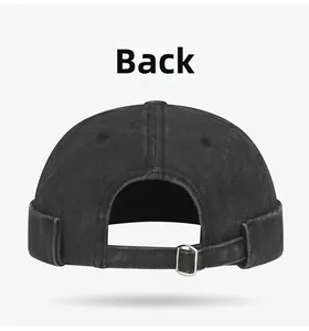 Detailed back view of vintage washed black brimless docker cap with adjustable metal buckle