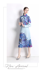 Detail view of blue hydrangea print polo shirt and matching pleated skirt with a gradient finish
