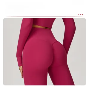 Close-up of high-waisted magenta yoga pants with ruched scrunch detail for peach butt effect