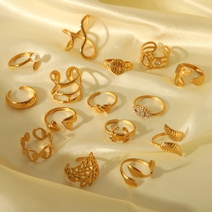 Detailed set of 15 gold plated stainless steel rings featuring leaf and pearl designs