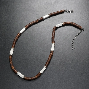 Detailed shot of ethnic necklace with brown coconut beads, white stone and lobster clasp