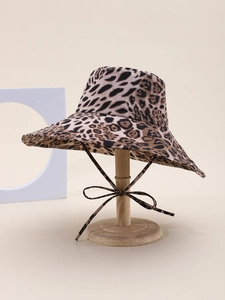 Detail of leopard print sun hat with wide brim and matching adjustable chin strap