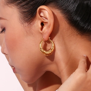 Chic 18K gold plated hollow triple striped hoop earrings on model for women
