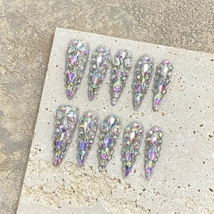 Handmade stiletto press-on nails with luxury AB rhinestones on shimmering silver base