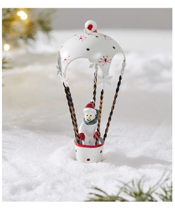 Outdoor close-up of a white snowman in a hot air balloon Christmas hanging decoration