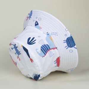 Detail of white cotton bucket hat featuring marine seahorse and coral print patterns