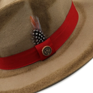Detail of wool fedora featuring red grosgrain ribbon, feather accent and vintage anchor badge