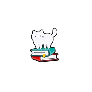 Cute white cat on colorful books enamel pin, high-quality cartoon metal badge accessory