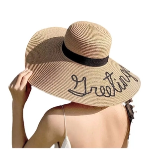 Women's wide brim straw sun hat in khaki with Greeting embroidery and black ribbon
