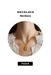 Detailed view of the 18K gold plated necklace featuring a textured teardrop pendant