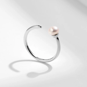 Elegant s925 silver open ring featuring a soft pink freshwater pearl on a polished band