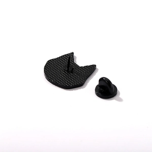 Minimalist black cat enamel pin with a textured metal back and rubber clutch fastener