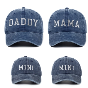 Close-up of Daddy, Mama and Mini embroidery on washed navy blue denim baseball caps
