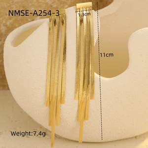 Detail showing elegant gold geometric tassel earrings with 11cm snake chain fringe