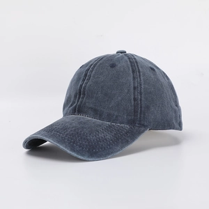 Detail of the six-panel construction and washed cotton texture on the baseball cap
