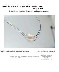 Detailed view of polished S925 sterling silver chain and natural baroque freshwater pearl