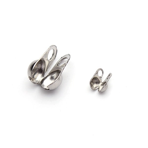Macro view of silver stainless steel ball chain end connectors in two sizes for jewelry
