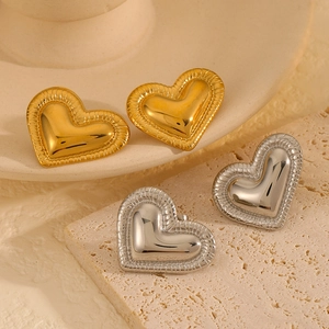 Elegant 18k gold and silver stainless steel heart earrings with textured edge detail