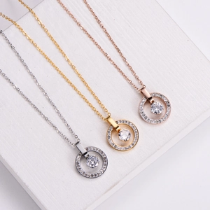 Three ferris wheel necklaces in silver, gold, and rose gold finishes with zircon pendants