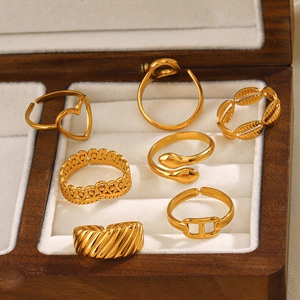 Set of 7 gold stainless steel open rings with heart, snake and geometric designs
