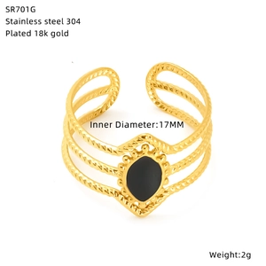 Detail showing 18k gold plated twisted stainless steel ring with black drop drip oil inlay