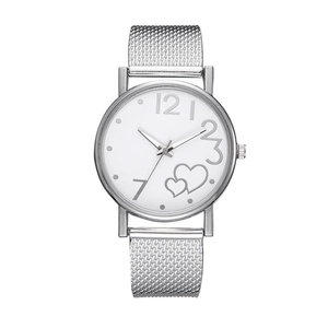 Detail of silver Milanese mesh strap and white dial with heart design on women's watch
