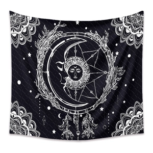 Detail of bohemian sun and moon tapestry with mandala patterns and dreamcatcher design