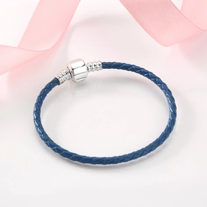 Deep blue braided leather bracelet featuring a 925 sterling silver minimalist clasp