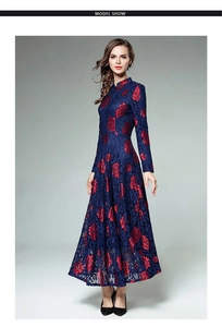 Detail of elegant navy lace maxi dress with red floral patterns and stand collar design