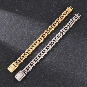 Detailed view of infinity knot chain links in gold and silver stainless steel