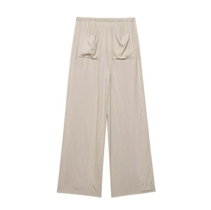 Detail of khaki wide-leg pants with elastic waist and delicate side lace embroidery