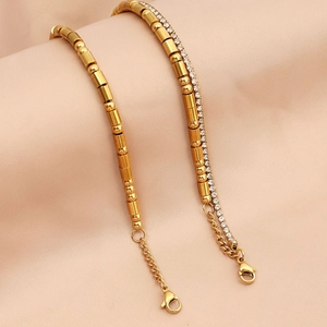 Detail of gold Morse code double-layered bracelet with rhinestones and lobster clasp