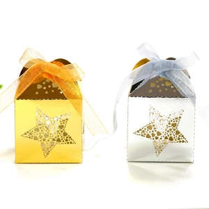 Golden and silver hollow star gift boxes with elegant ribbon bows on white background